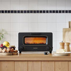 BALMUDA The Toaster | Steam Oven Toaster | Compact Size 14.1" W x 12.6" D x 8.2" H | 5 Cooking Modes: Sandwich Bread, Artisan Bread, Pizza & Pastry, Oven | Baking Pan Included | US Version | Black