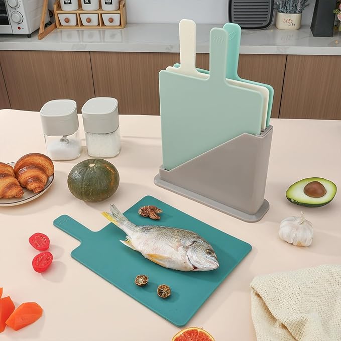 Plastic Cutting Boards for Kitchen, 4-Pieces Cutting Board With Food Icons And Storage Stand, Easy Grip Handle, Professional Chopping Board Set for Meat, Veggies, Fruits（12.9"X 9.4" X 3.1")